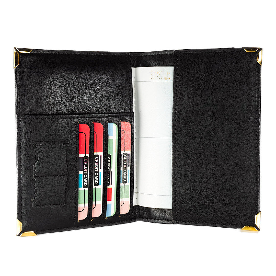 Black passport cover with card slots and a money clip on a white background