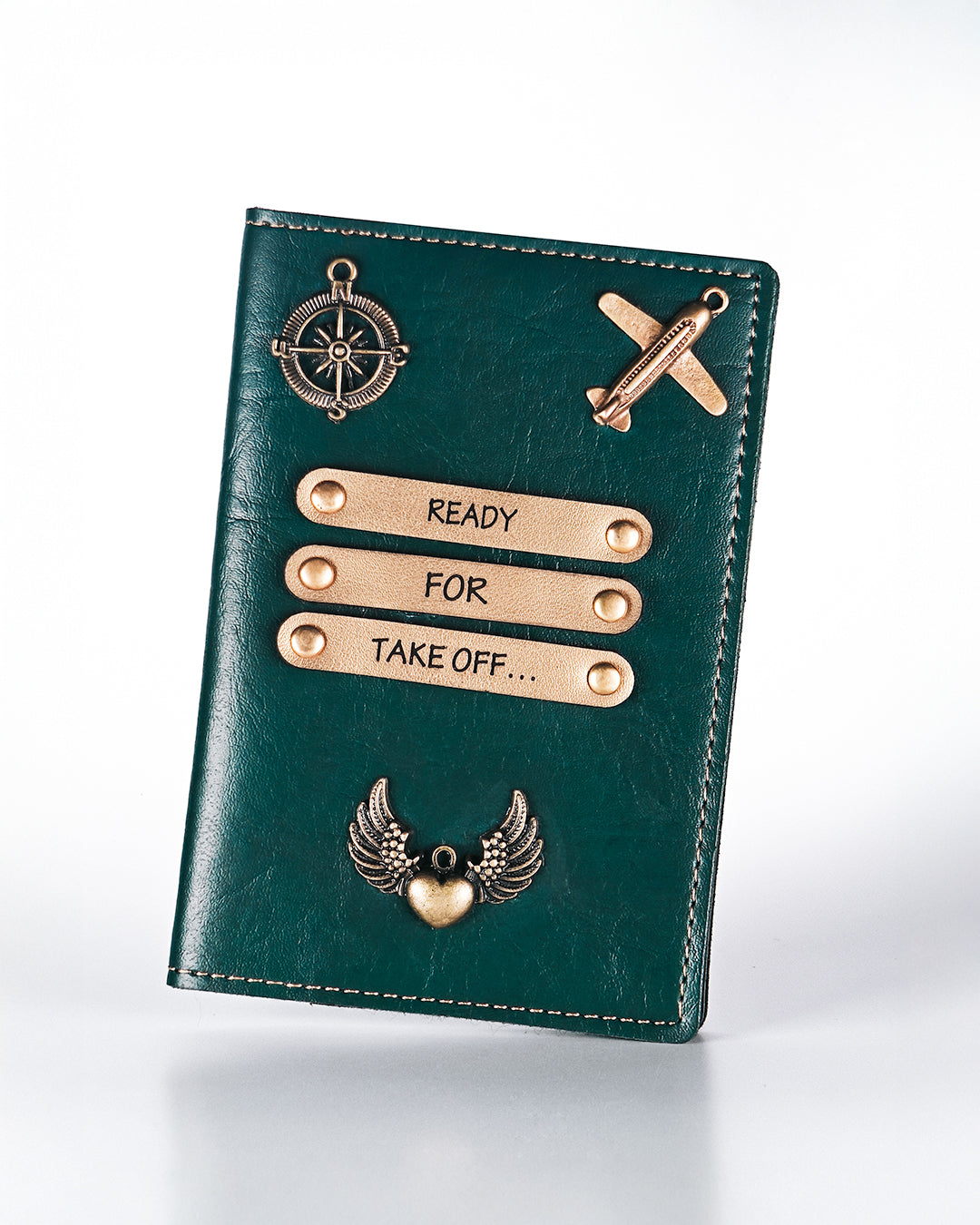 Green leather passport holder with gold accents and text on a white background