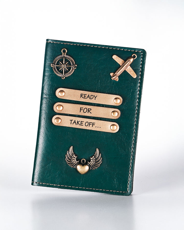Green leather passport holder with gold accents and text on a white background