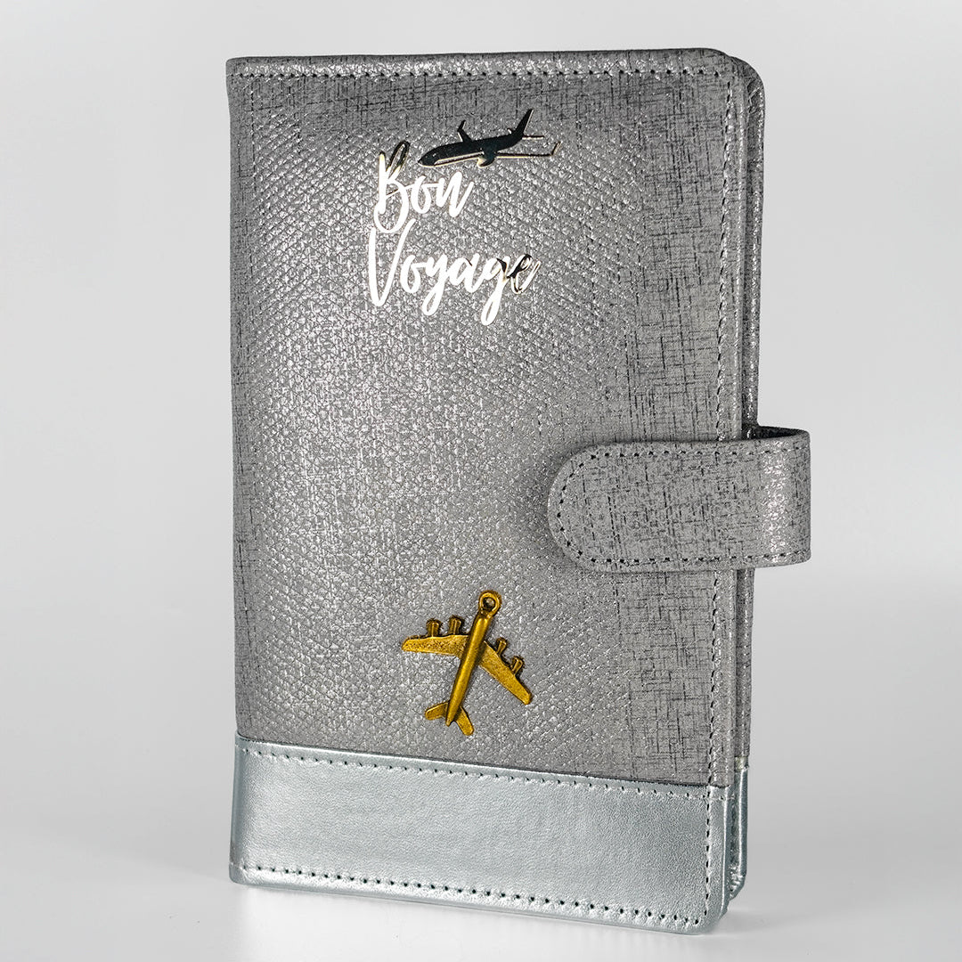 Gray travel planner with 'Bon Voyage' and airplane designs on a white background