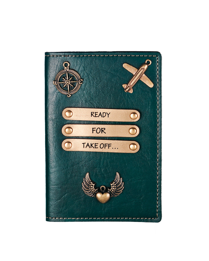 Green leather passport holder with decorative elements on a white background