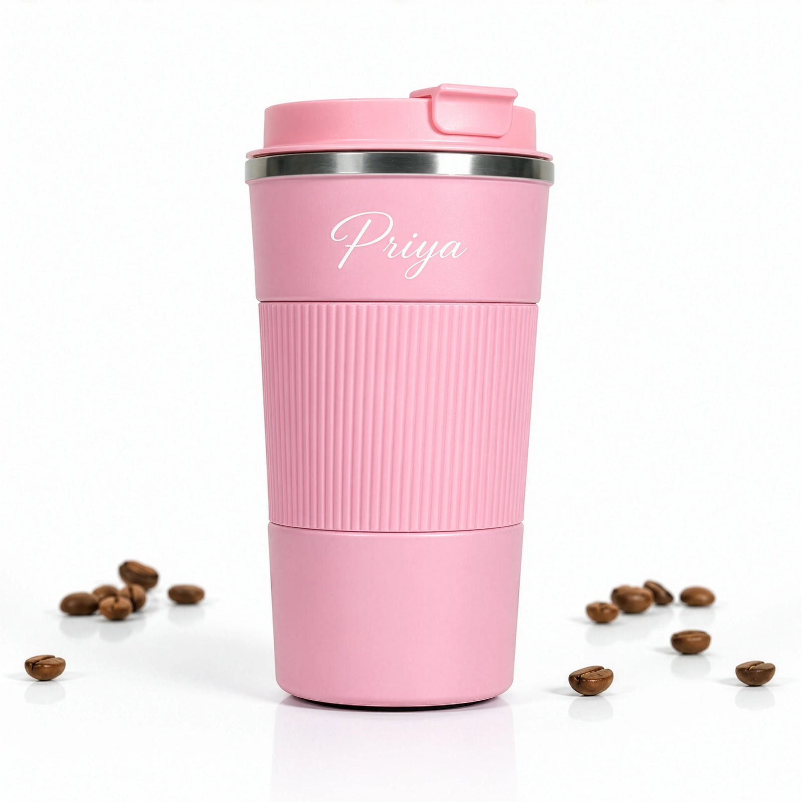 Pink travel mug with 'Priya' on a white background with coffee beans-TPC Gifts
