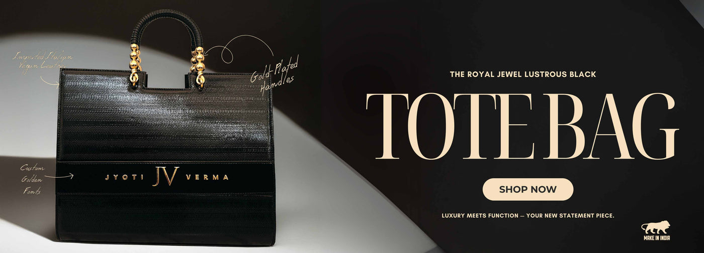 Black personalized tote bag with gold accents on a dark background, featuring the brand 'IV' and text promoting the product by TPC Gifts