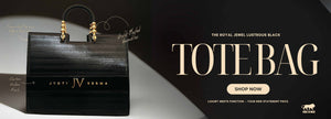Black personalized tote bag with gold accents on a dark background, featuring the brand 'IV' and text promoting the product by TPC Gifts