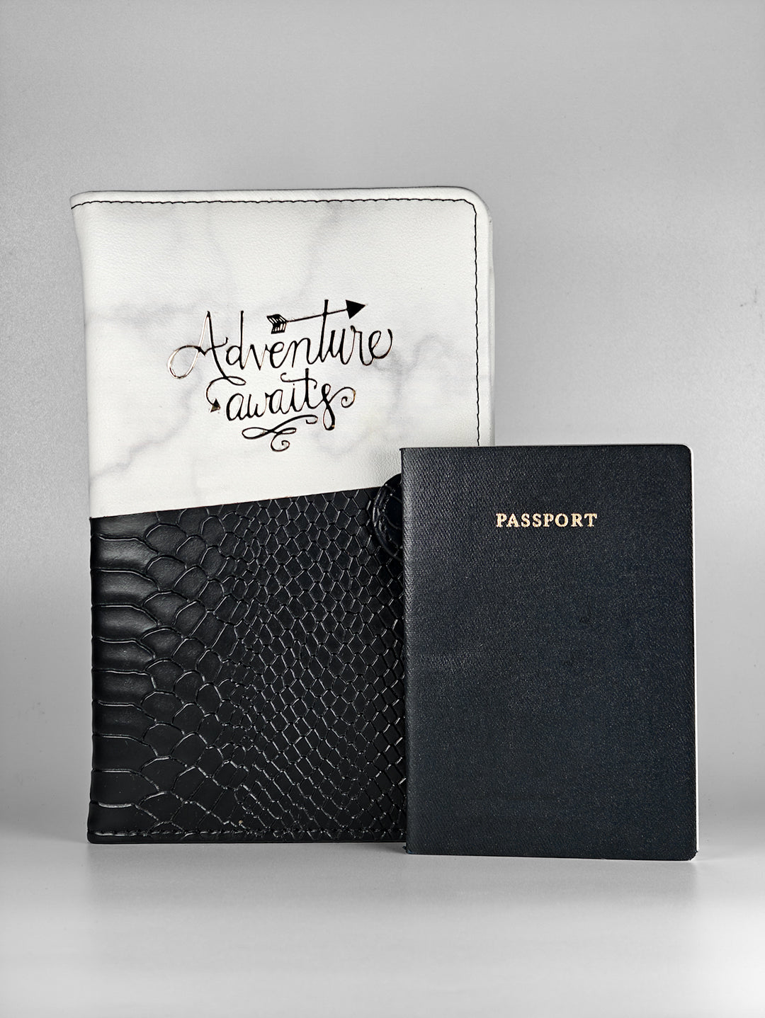 Travel organizer with personalized name tag and embossed ‘Adventure Awaits’ design – a trendy passport cover and passport holder for all travel essentials.