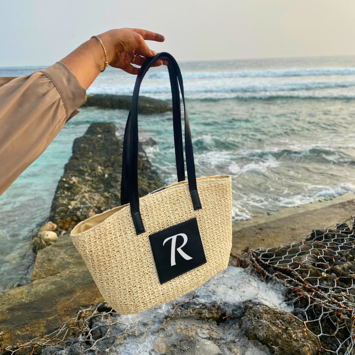 Personalised Cream Cane Beach Bag - Luxe Edition on the beach. Cane beach bag by TPC gifts
