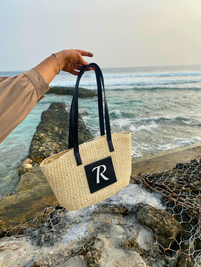 Personalised Cream Cane Beach Bag - Luxe Edition on the beach. Cane beach bag by TPC gifts