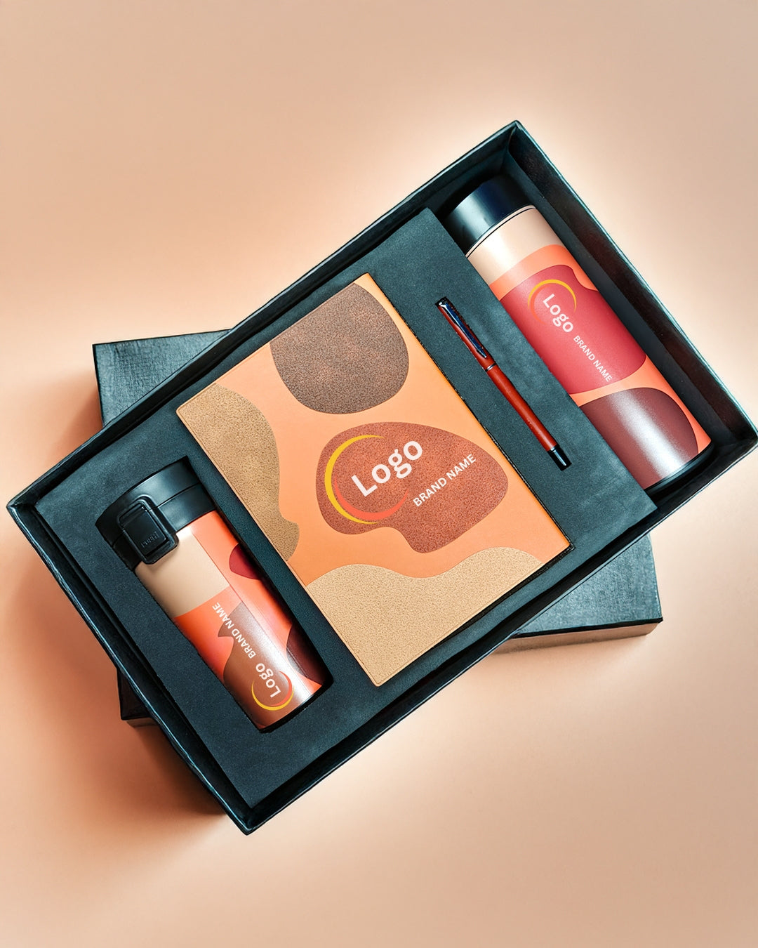 Product set with bottles and a card in a black box on a beige background
