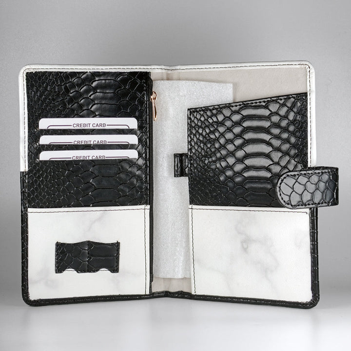 Custom passport holder and travel organizer with black textured design, featuring gold foil ‘Adventure Awaits’ text – a premium passport cover for travel lovers.