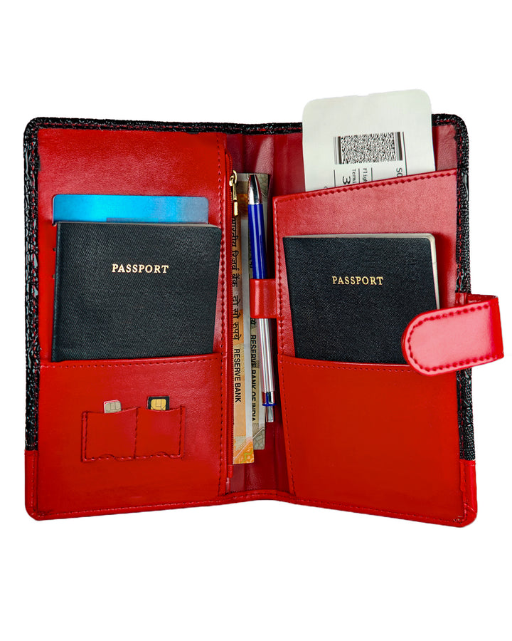 Red travel wallet with compartments for passports and documents on a white background