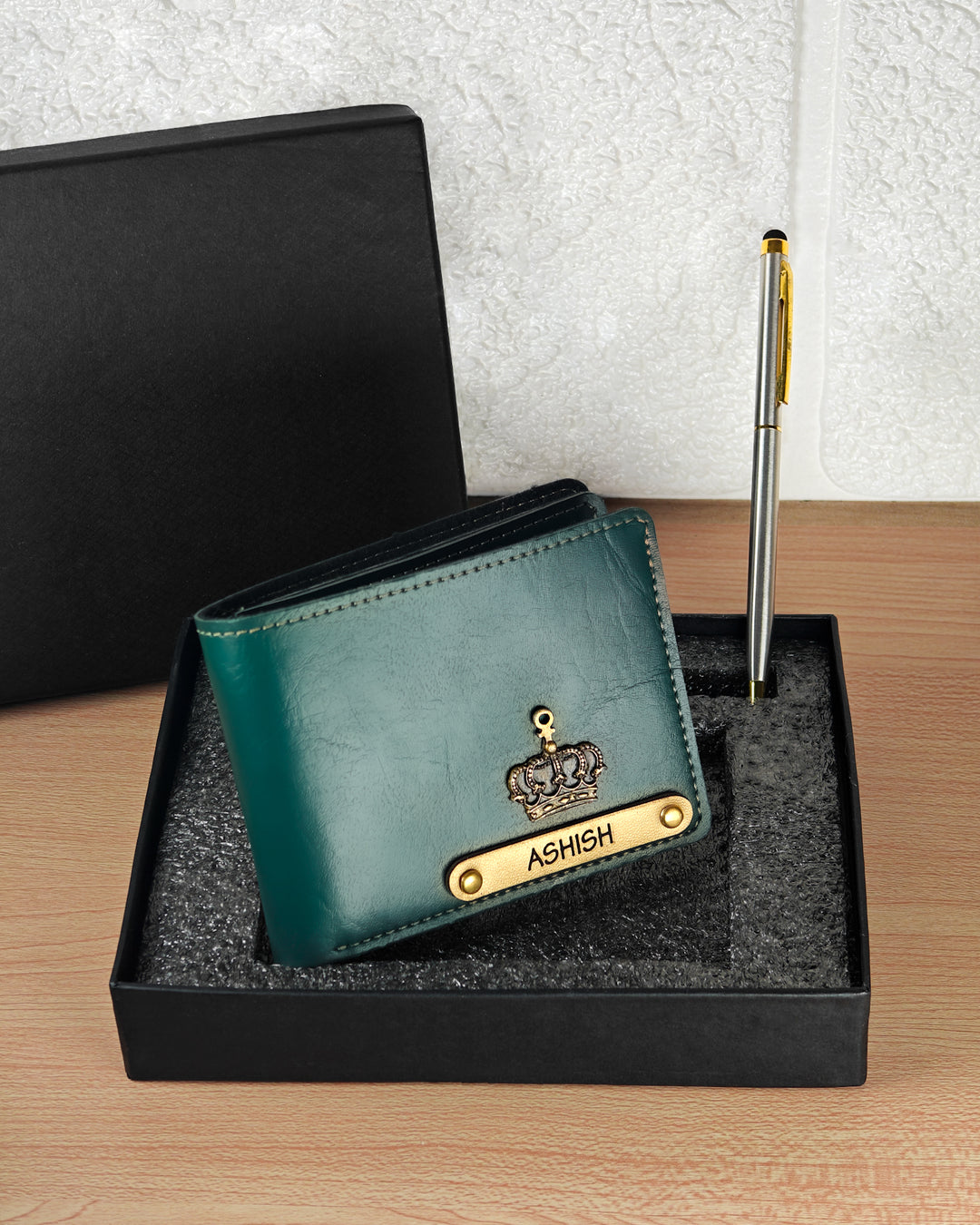 Green wallet with gold accents and &