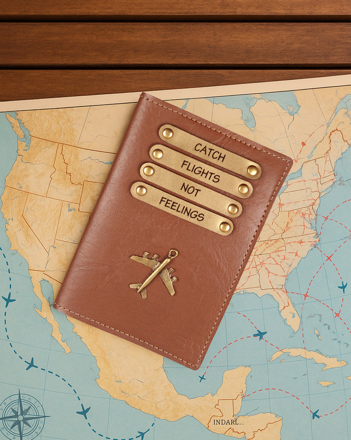 Brown leather passport holder with gold accents on a map of the United States