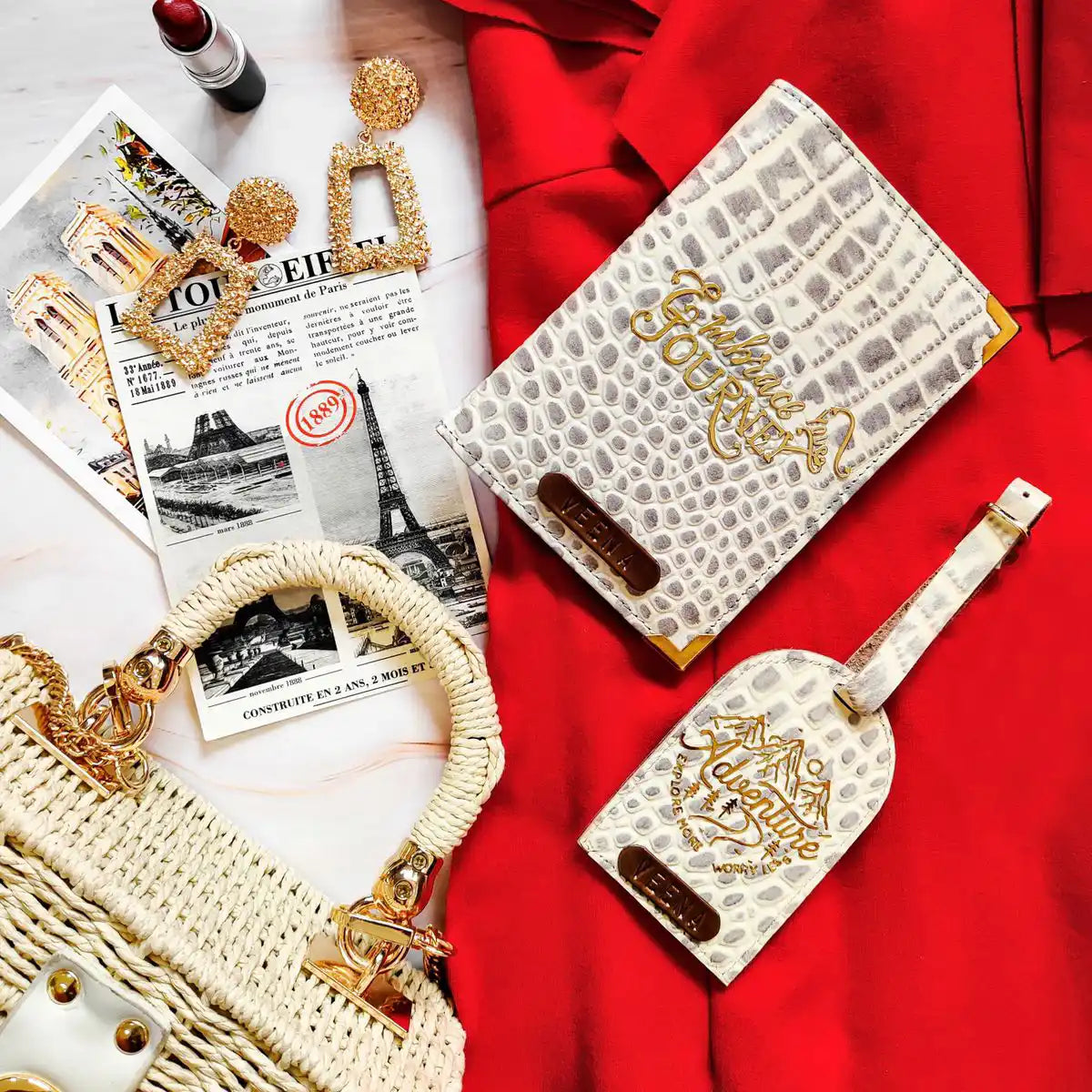 A set of genuine leather passport cover and luggage tag set in a red dress context, including a passport cover with a gold embossed design and a luggage tag with a name tag -TPC Gifts