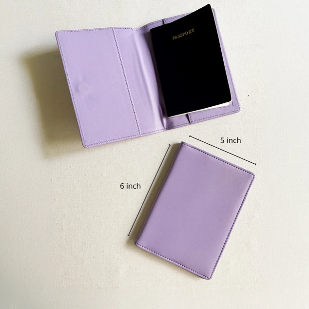 A lavender purple passport cover shown in two views on a light beige background: one open with a black passport inside and one closed. Black dimension lines and text indicate measurements of 6 inch by 5 inch.