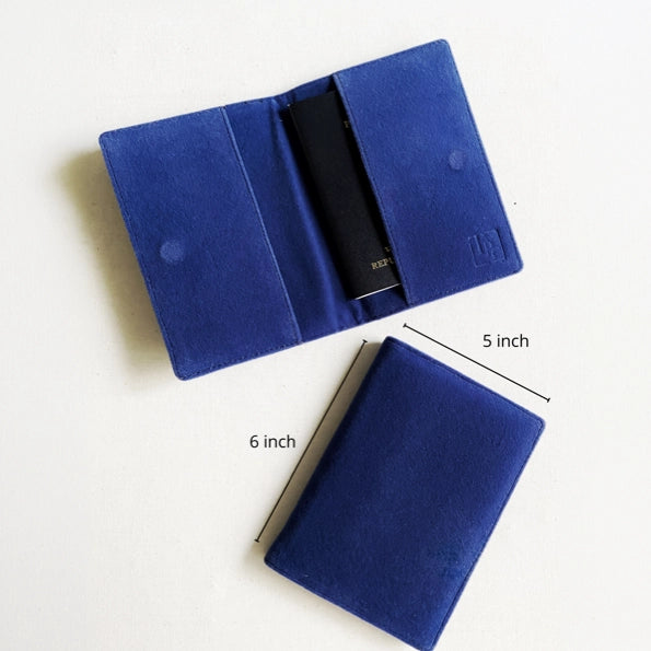A blue velvet passport holder shown open and closed on a white background, with dimension lines indicating 5 inch width, 6 inch height, and a folded depth of 4 inch.