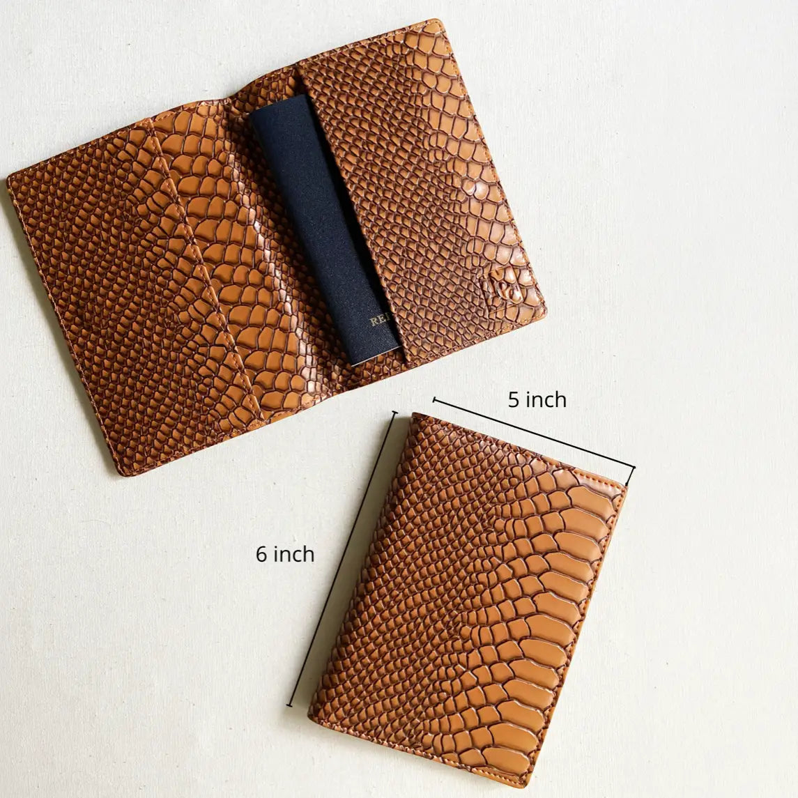 A brown snake embossed leather card holder wallet shown open and closed on a light background, with dimension labels indicating 5 inch width, 6 inch height, and a navy interior pocket.
