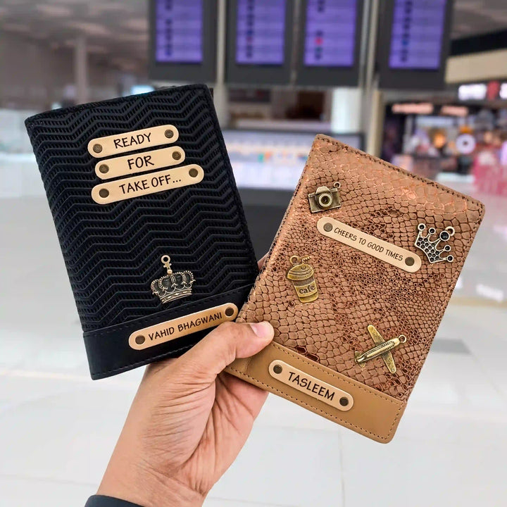 black ziggy and bronze python couple passport cover with personalised names and charms on it   - TPC Gifts