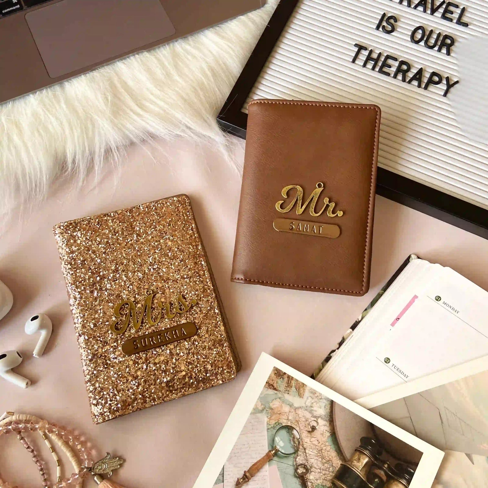 Two personalized Premium designer couple passport covers golden and brown in colour displayed in a styled flat-lay with a gold foil 'Mr. & Mrs. - TPC Gifts