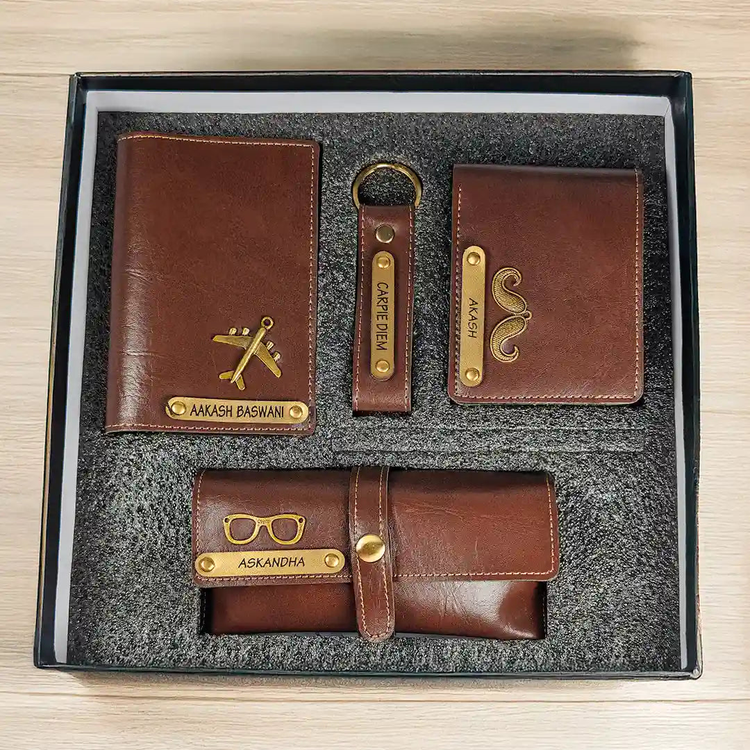 A 4-piece brown leather wallet set in a black gift box, including a main wallet, a card holder, a keychain, and a belt bag, all with gold-colored metal accents and custom names engraved.
