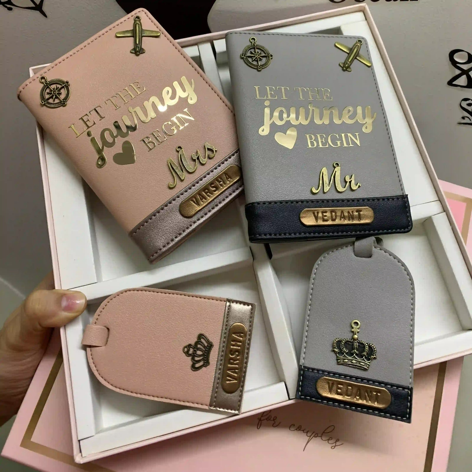  A set of personalized passport covers and luggage tags displayed in a white box, featuring gold bronze motifs and customized text with couple edition box -TPC Gifts