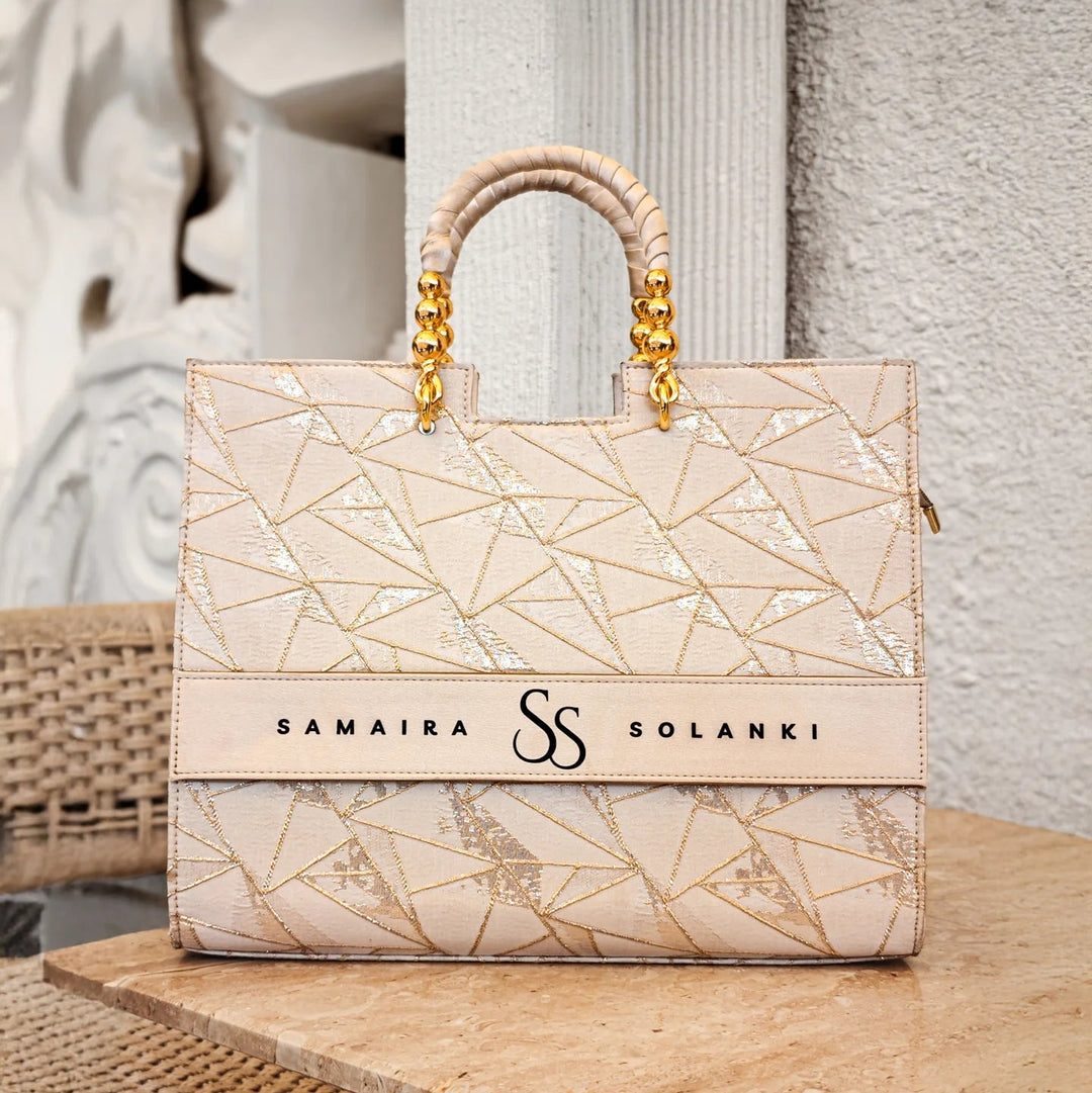 Ivory personalized tote bag with name by TPC Gifts on a table