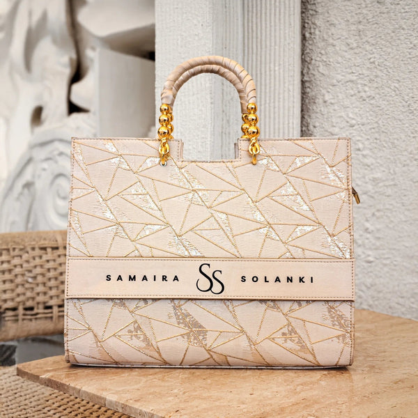 Ivory personalized tote bag with name by TPC Gifts on a table