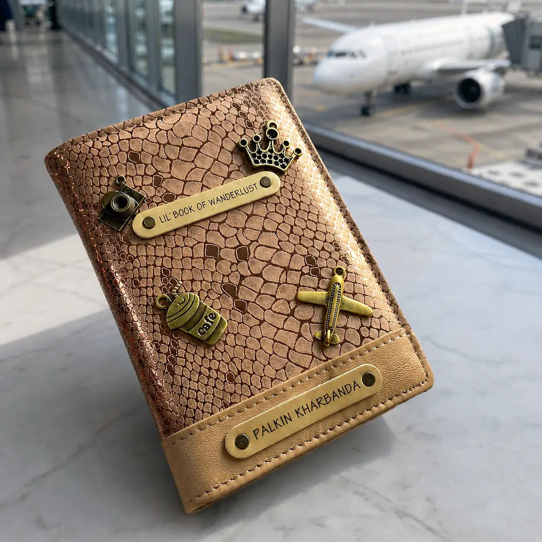 Brown textured passport holder with airplane and crown designs in an airport setting - TPC Gifts