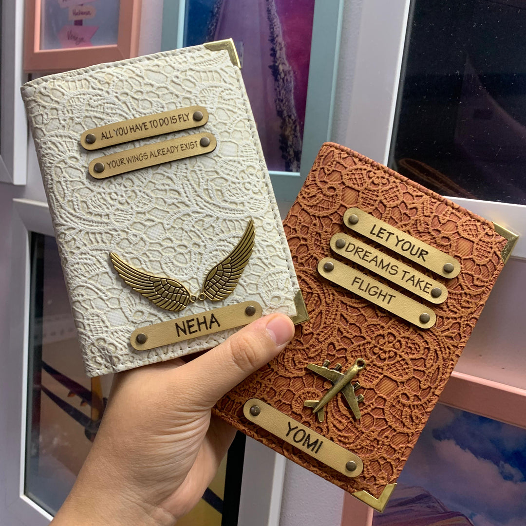 white and rustic brown Couple passport covers by TPC gifts in the hand of a customer with names Neha and Yomi