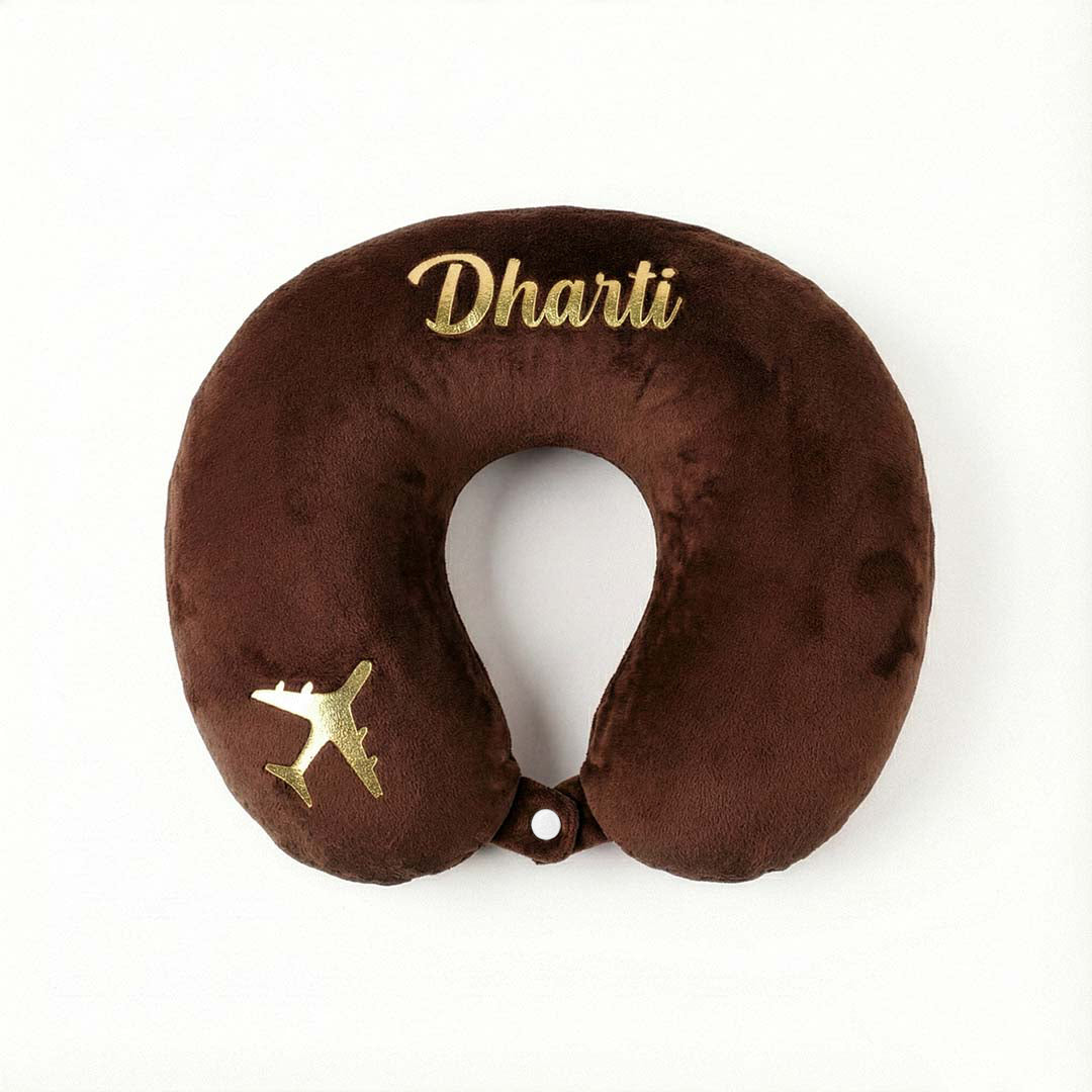 Brown travel neck pillow with &