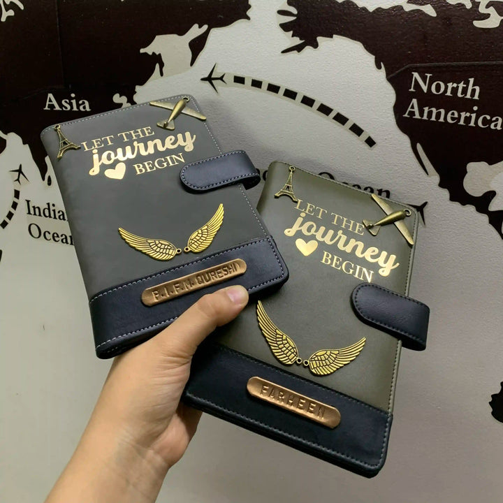 Dual tone couple travel organiser  held by a hand with &