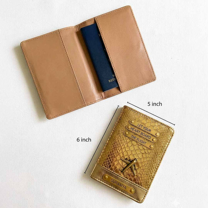 Brown leather passport holder with blue passport inside, next to a gold embossed cardholder with measurements on a white background.