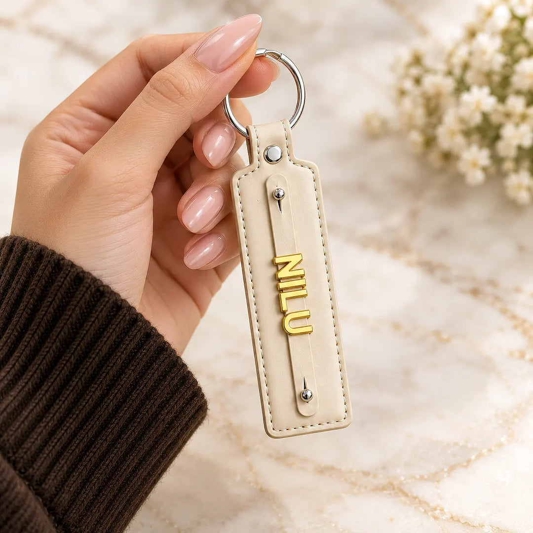 Cream Beige vegan-leather keychain with gold-tone name letters