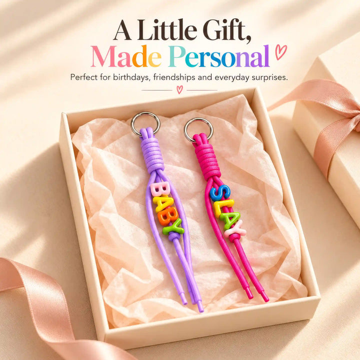 Lavender and Hot Pink personalised rope keychains shown in a gift presentation
