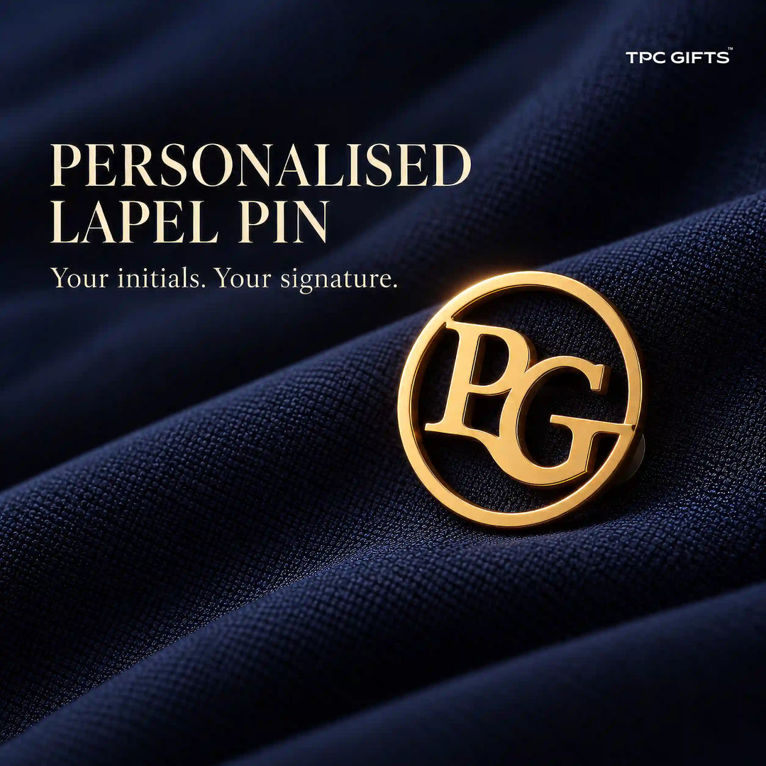 Personalised gold tone circular two initial monogram lapel pin on navy fabric