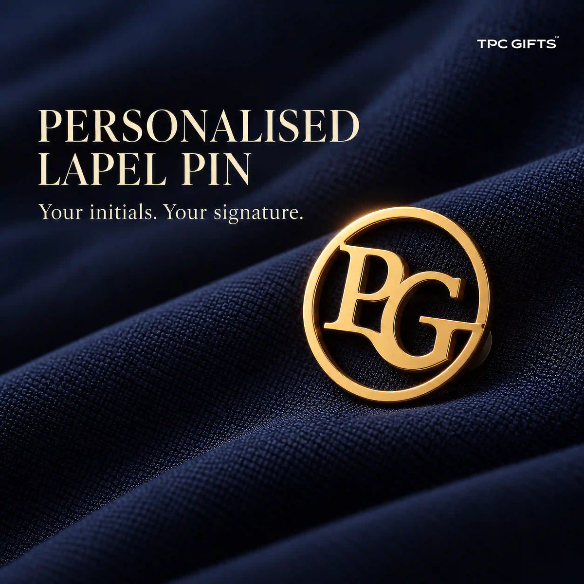 Personalised gold tone circular two initial monogram lapel pin on navy fabric