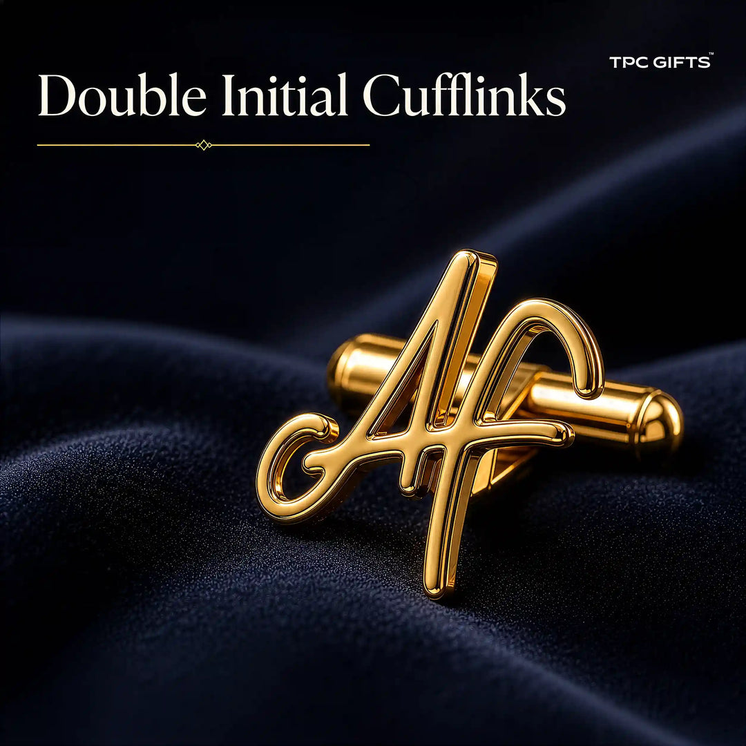 A pair of gold double initial cufflinks spelling &