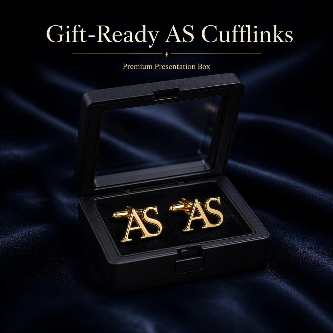 A pair of gold initial cufflinks spelling &
