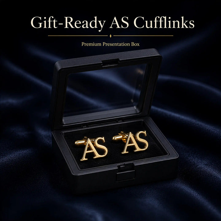 A pair of gold initial cufflinks spelling &