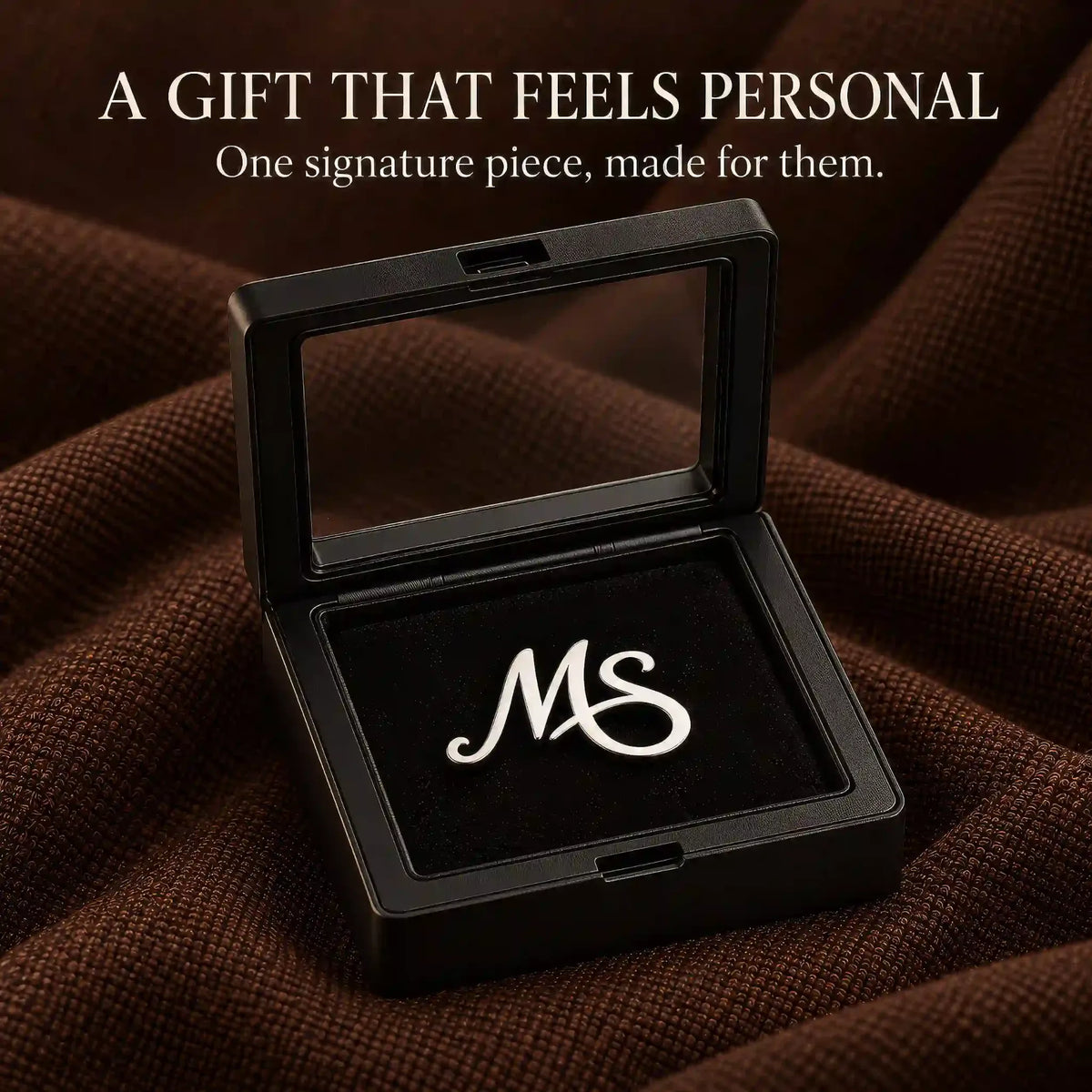 Personalised silver tone lapel pin displayed in a black presentation box