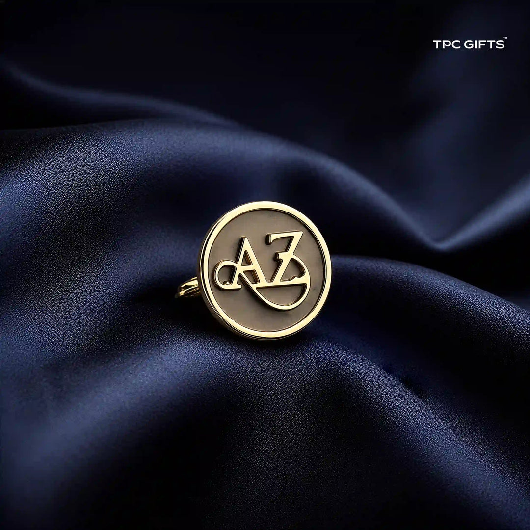 A gold-toned circular ring with interlocking &