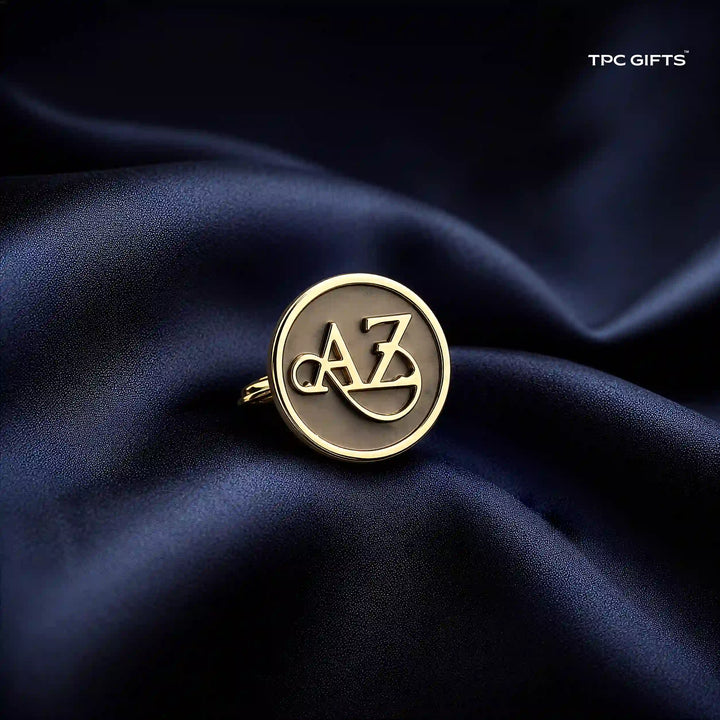 A gold-toned circular ring with interlocking &