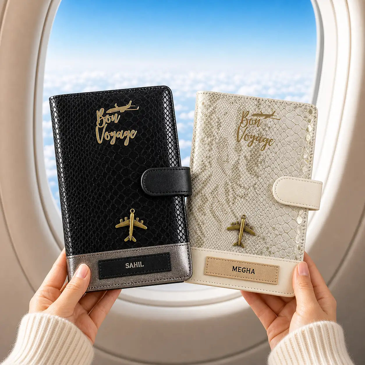 Two personalized travel planners held by hands with airplane design and 'Bon Voyage' text, against a window view - TPC Gifts