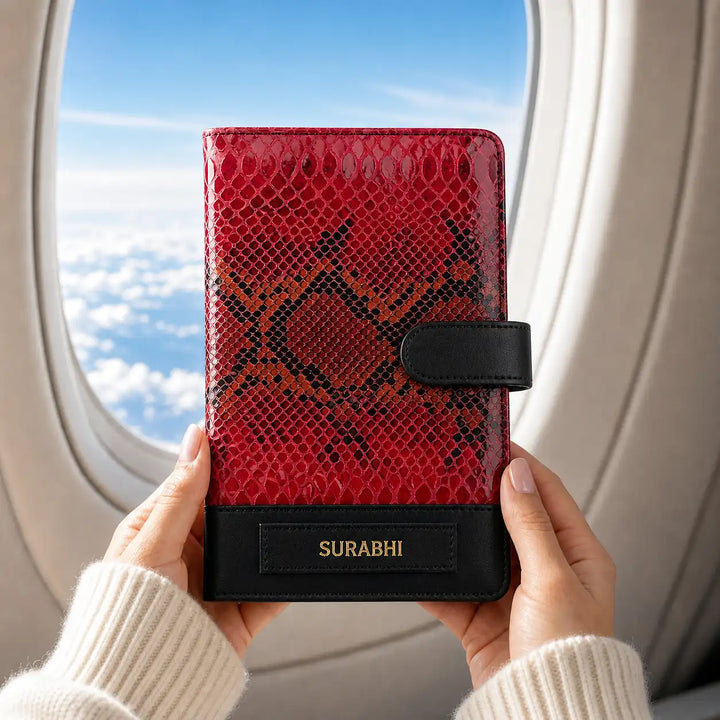 Odessy Red patterned genuine leather travel organiser  wallet held by hands with airplane window in background - TPC Gifts