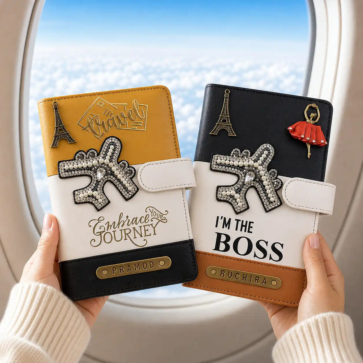 Two decorative travel wallets held by hands with a window view in the background - TPC Gifts