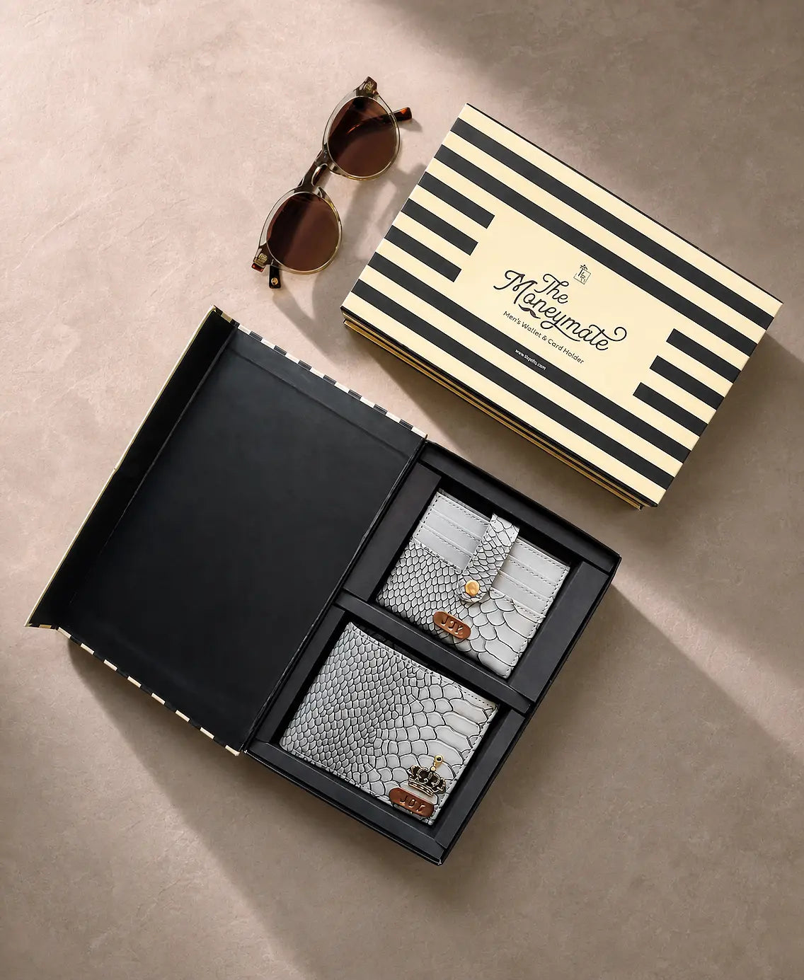 Two snakeskin-patterned card holders in a black box with a striped box labeled 'The Moneymate' on a beige surface by tpc gifts personalized wallet for men