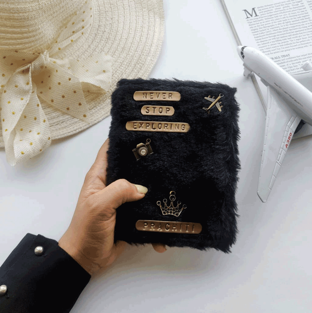 Personalised Black Fur Passport Cover by TPC Gifts. Comes with various charms and quotes. 