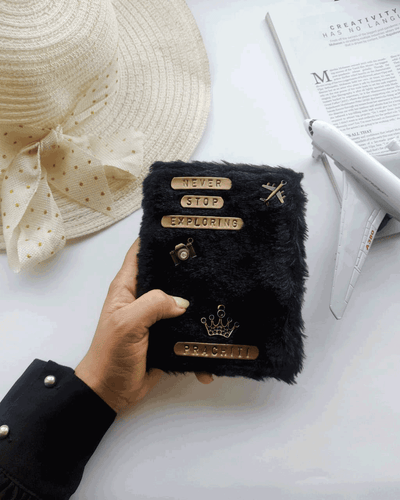 Personalised Black Fur Passport Cover by TPC Gifts. Comes with various charms and quotes. 