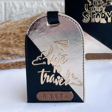 A black and gold multi tone luggage tag with the text &