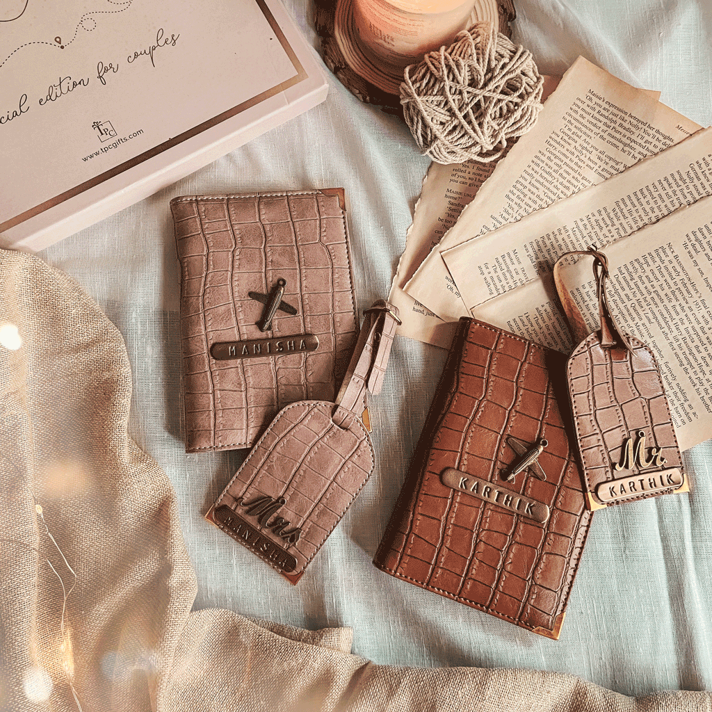 Couple Passport Cover & Luggage Tag Stylish croco design in a flat lay with 2 lugagage tags and a candle and a gift box 